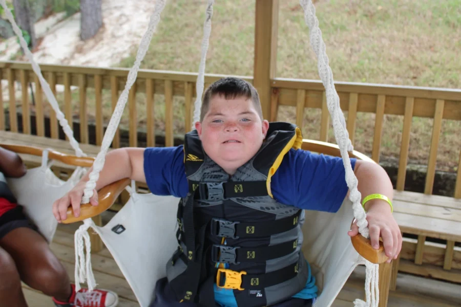A camper hangs out in a swing